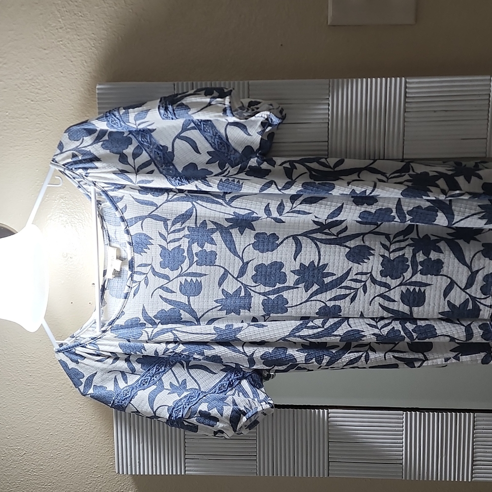 This is a Blue Floral shirt it is Brand New 💙.